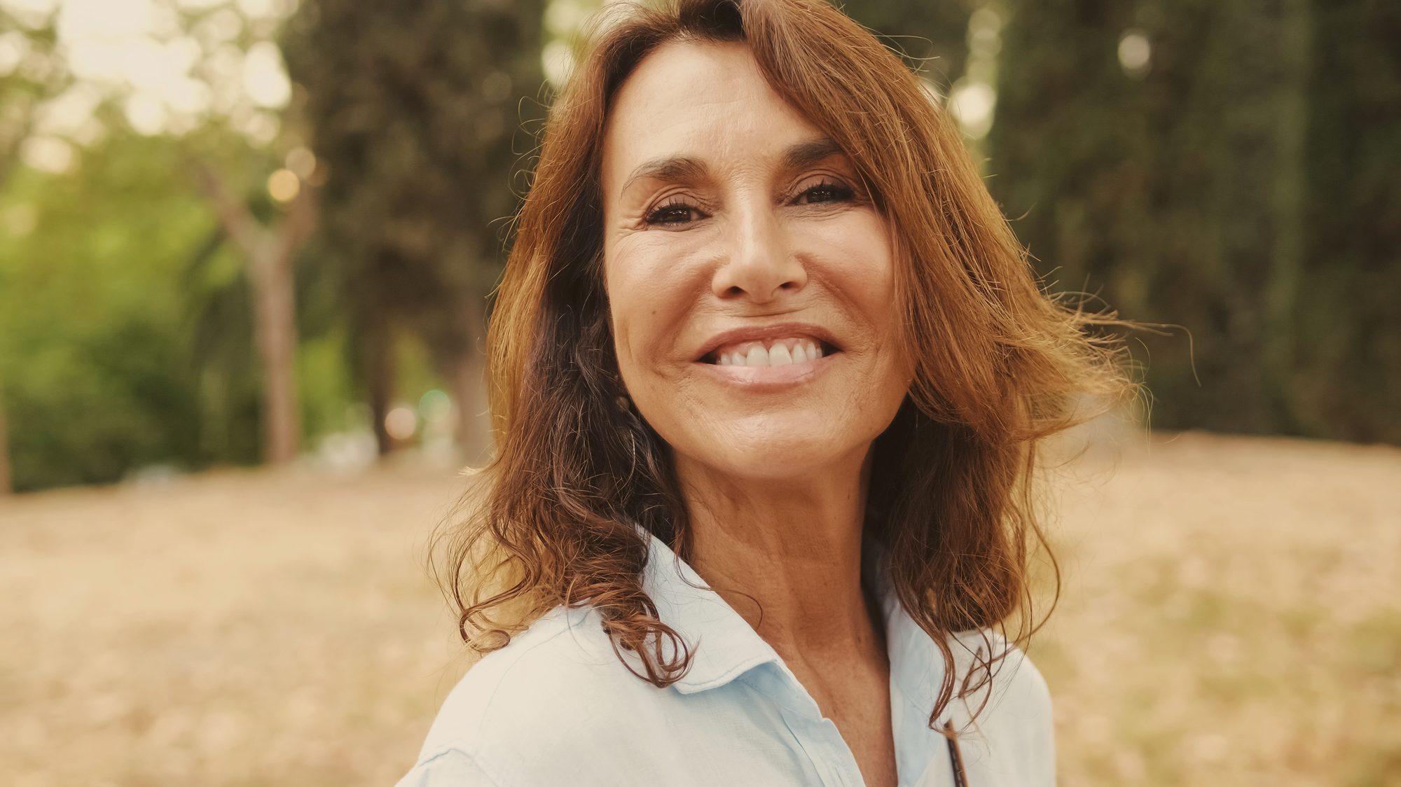 A radiant woman in her fifties